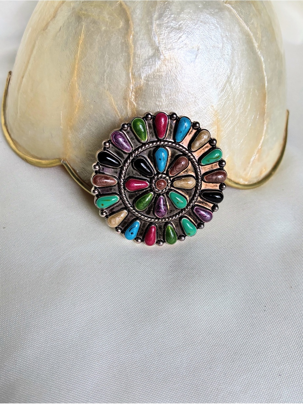 Multi-colored circular design and teardrop-shaped enamel brooch in various color